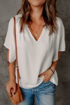 Loose-fitting white pleated split-neck top