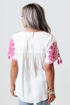 White straight top with short sleeves and embroidered flowers