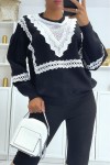 Oversized puff sleeve sweater with lace pattern.