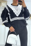 Oversized puff sleeve sweater with lace pattern.