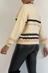 Beige sweater with puff sleeves and retro patterns.