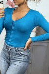 Blue cardigan in very stretchy and very soft knit.