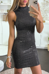 Black cocktail dress with sequins and sleeveless high neck.