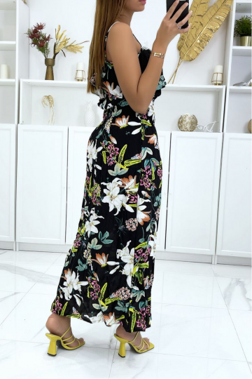 Long black dress flowered with multicolored orchids