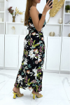 Long black dress flowered with multicolored orchids