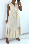 Long double breasted dress in beige with pattern and lace.
