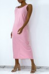 Long fluid pink dress with button on the front and slit at the back.