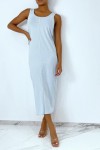 Long fluid turquoise dress with button on the front and slit at the back.