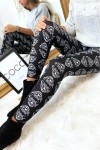 Black winter leggings with white tiger head patterns.