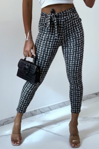 Black slim pants with pocket pattern and belt.