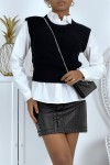 Short black sleeveless sweater with a round neck.