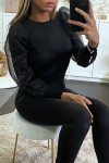 Black sweater with puffy lining on the tulle sleeves