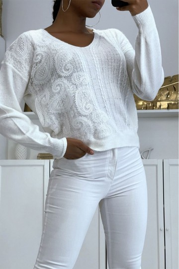 White V-neck sweater with white lace pattern.
