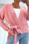 Very warm powder pink wrap-over top in chunky knit with puffed sleeves.