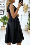 Flared black dress with pearls and elastic at the bust