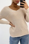 Shiny pink V-neck sweater with openwork line detail.