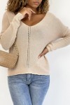 Shiny pink V-neck sweater with openwork line detail.