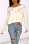 White lace V-neck sweater with drop sleeves.