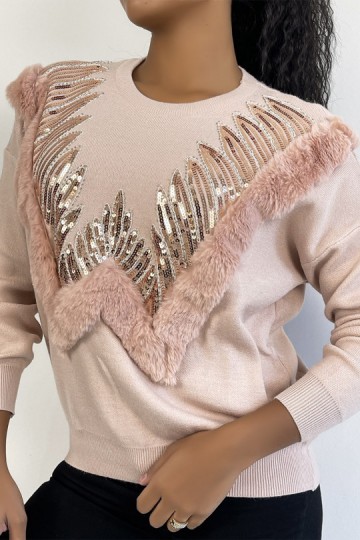 Pink sweater with round neck and faux fur and rhinestone pattern.