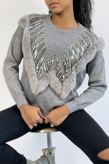 Gray sweater with round neck and faux fur and rhinestone pattern.