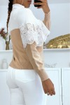 Loose-fitting taupe and white two-tone cropped jumper with high collar and lace veil at the chest.