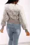 Gray to white gradient jumper in stretch material with a puffy effect and inscription.