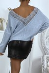 Flowing blue sweater in soft knit with pretty bare back.