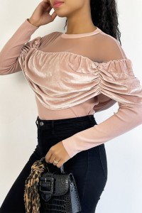 Pink velvet effect top and transparent mesh at the shoulders for a boat neck effect.
