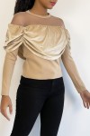 Beige velvet effect top and transparent mesh at the shoulders for a boat neck effect.