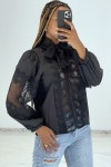 Black puffy zip blouse with openwork details.