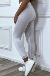 White leggings with lace at the waist and bottom.