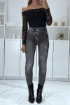 Black high-waisted fleece leggings with faded and ripped denim pattern