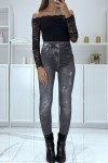 Black high-waisted fleece leggings with faded and ripped denim pattern
