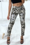 Military slim pants for women with pockets and silver pattern on the legs.
