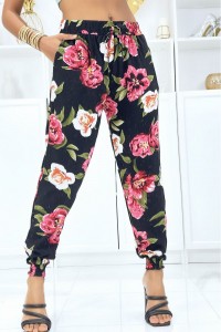 Black pants with elastic flowers at the waist and ankles