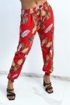 Fluid red pants with foliage pattern.