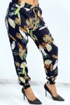 Fluid navy pants with foliage pattern.