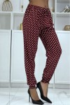Flowing burgundy pants with polka dots and elastic ankles