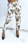 Fluid white pants with foliage pattern.