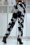 Flowing black pants with floral pattern