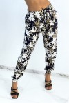 Fluid navy pants with tropical print tightened at the ankles