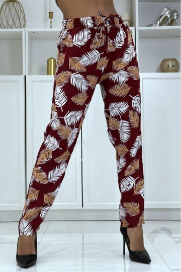 Fluid red pants with floral pattern