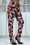 Fluid red pants with floral pattern