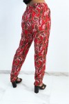 Fluid red straight-cut pants with colorful foliage print