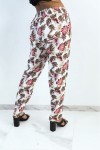 Flowing white straight-cut pants with colorful foliage print
