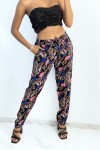 Straight-cut fluid black trousers with colorful foliage print