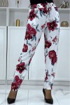 Flowing white pants with floral pattern