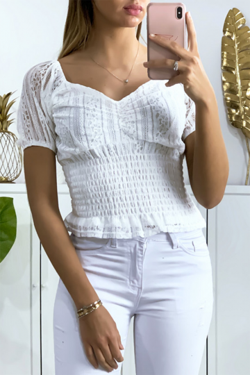Women's white lace crop top with elastic waistband.
