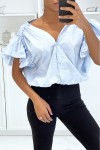 Women's blue shirt blouse buttoned at the front with flounce