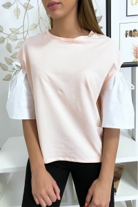 Pink top with puff sleeve with lace up and bare.